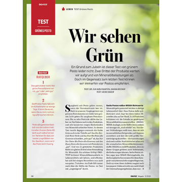 Textseite mit Überschrift 'Wir sehen Grün' und Artikel über grünes Pesto, inklusive ÖKO-TEST Logo und Testhinweise. Hintergrund verschwommene Abbildung von Basilikum